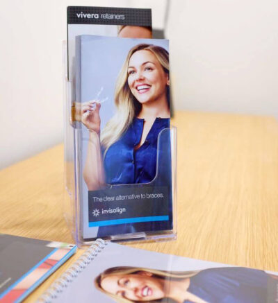 Hulme Court Dental and Implant Centre - Your Smile is Priority Banner Image Invisalign Banner Image Girl Smiling With Invisalign Brace